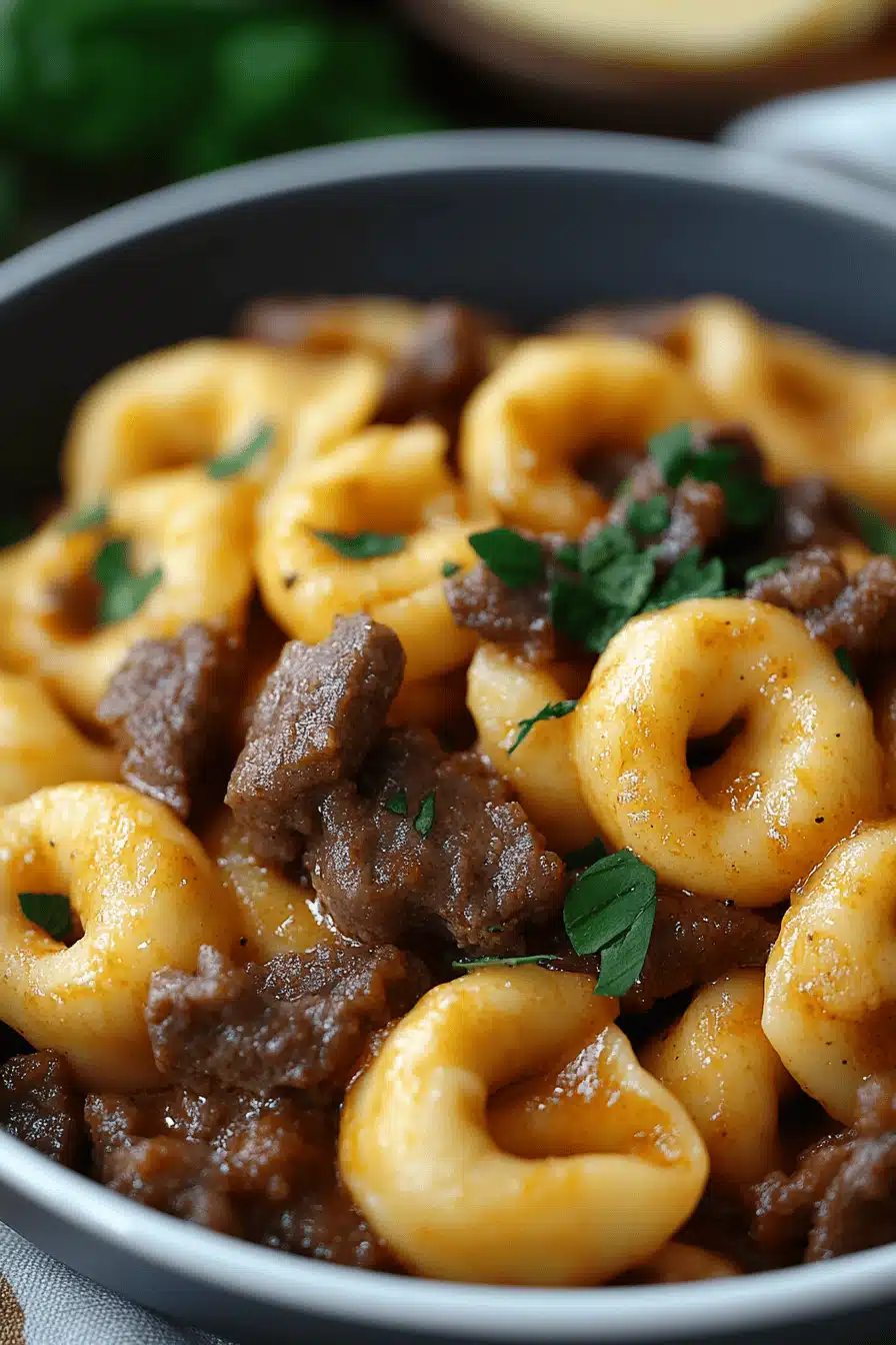 Cheesesteak Tortellini Recipe slice on plate showing perfect texture and swirl pattern