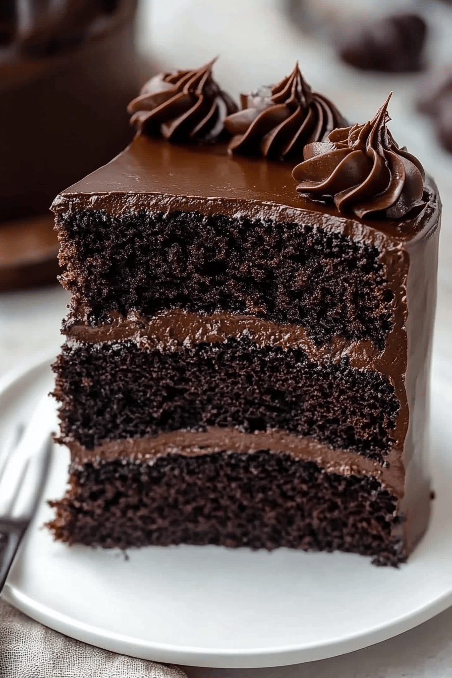 Black Velvet Cake Recipe slice on plate showing perfect texture and swirl pattern