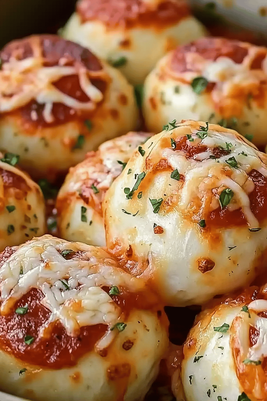 Cheesy Pizza Bombs slice on plate showing perfect texture and swirl pattern