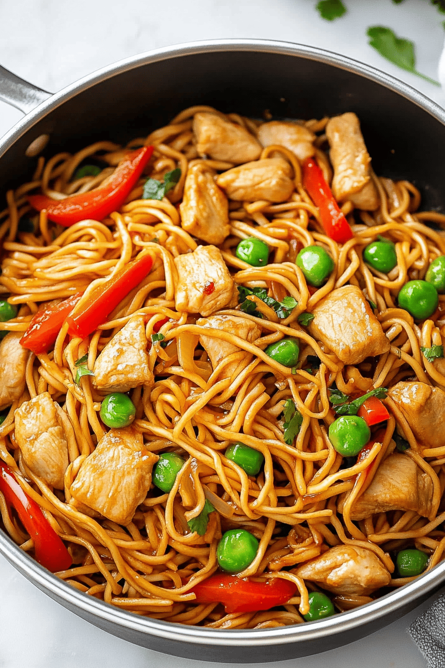 Chicken Lo Mein Recipe ingredients organized and measured on kitchen counter