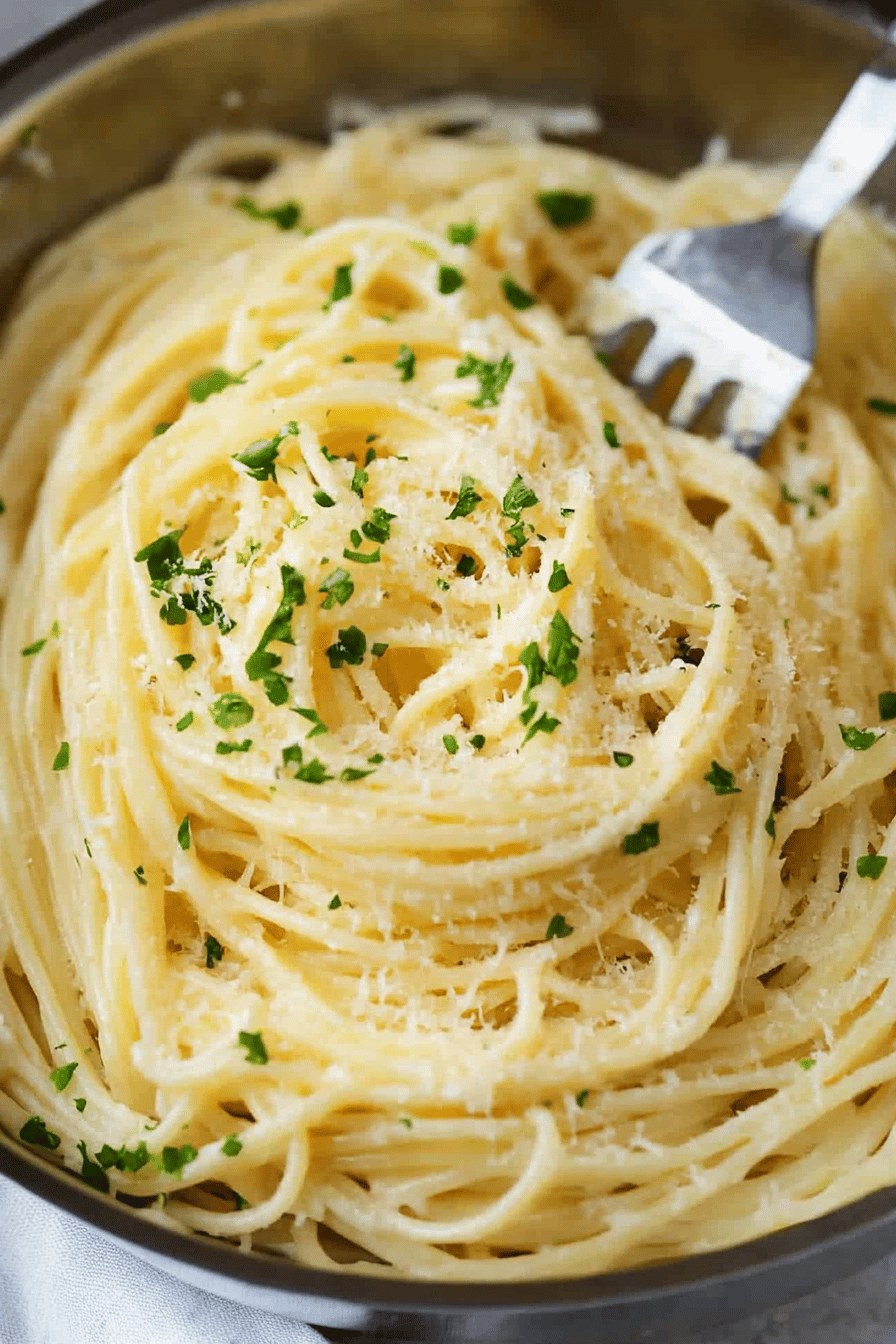 Garlic Parmesan Pasta slice on plate showing perfect texture and swirl pattern