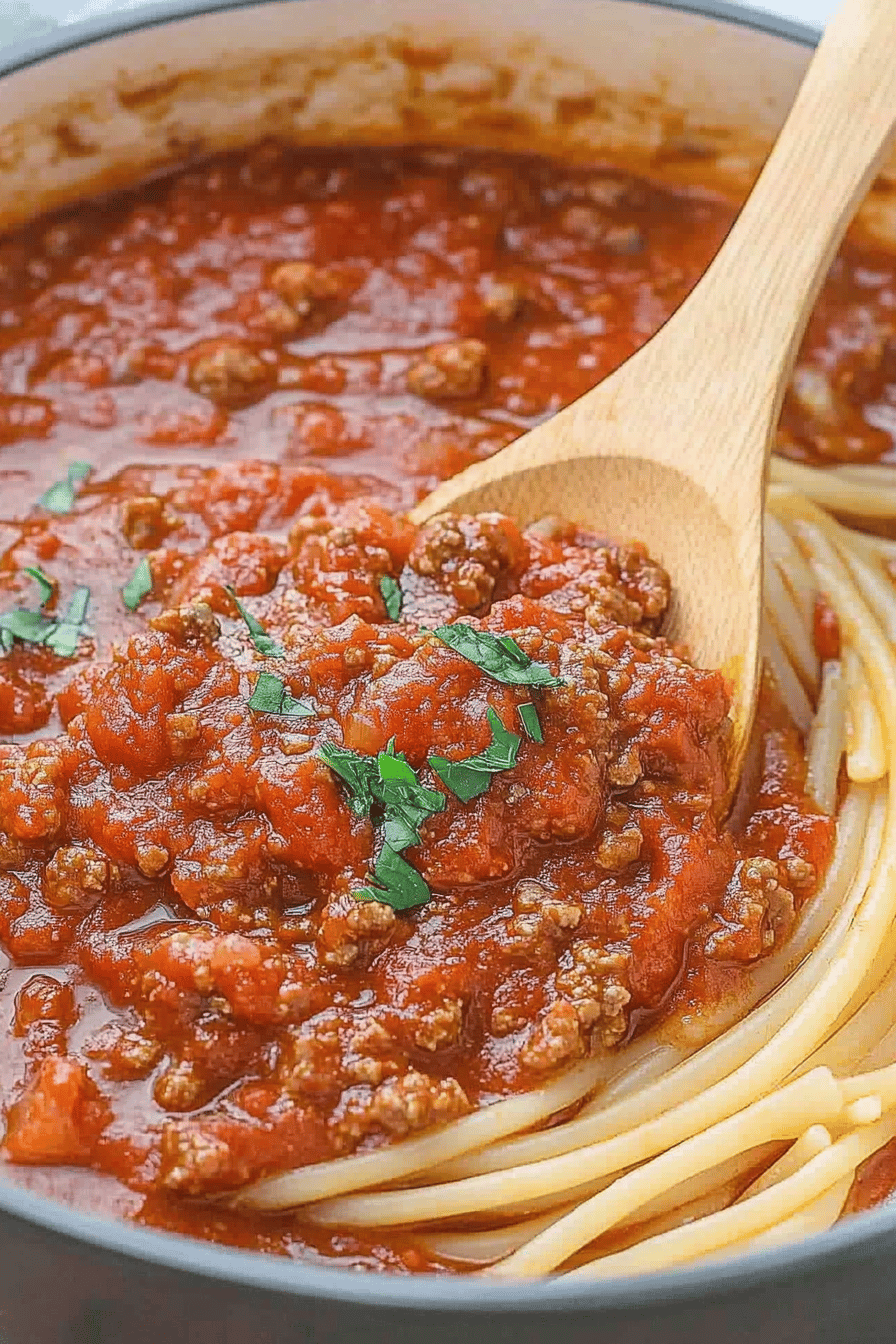 Homemade Spaghetti Meat Sauce ingredients organized and measured on kitchen counter