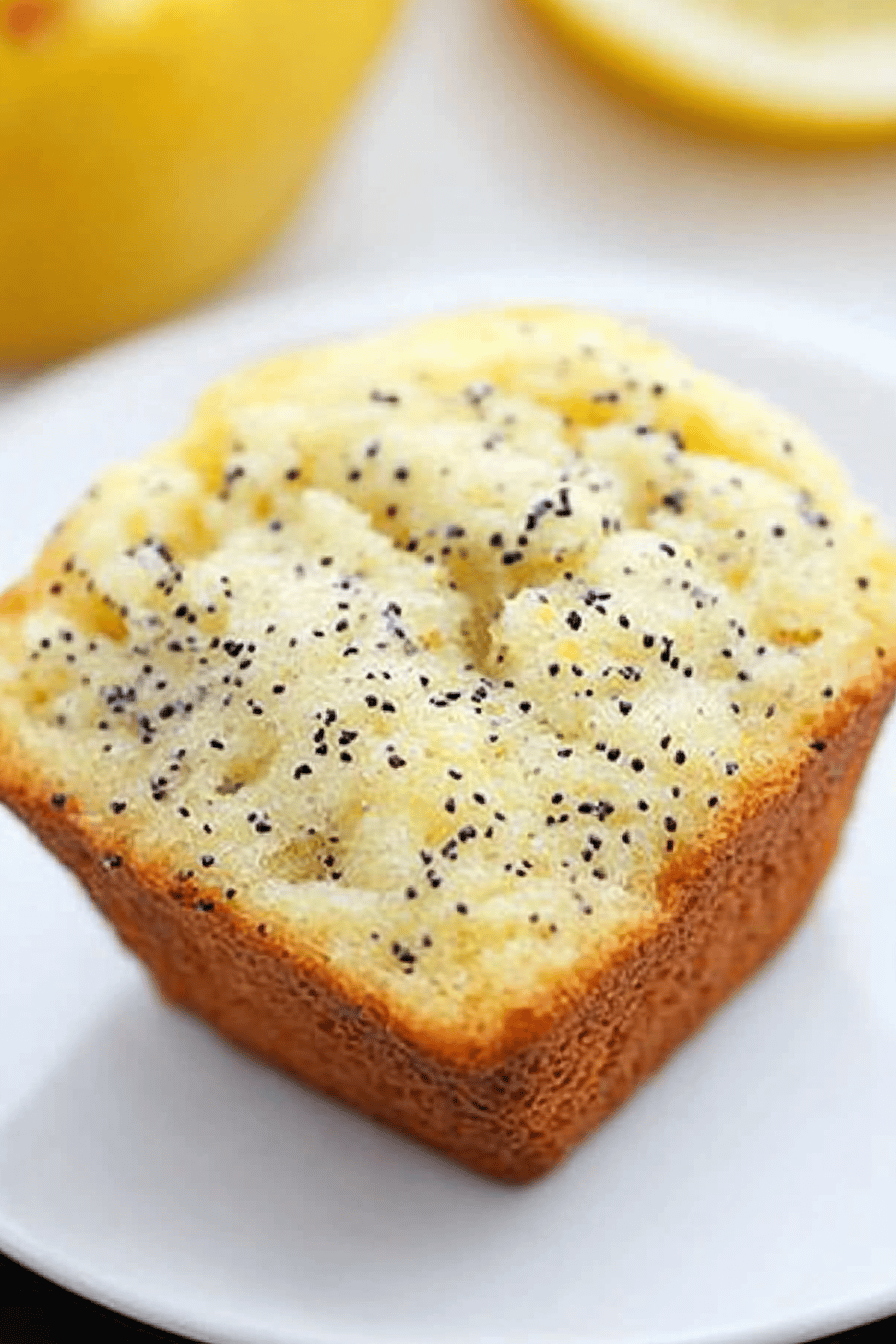 Lemon Poppyseed Muffins slice on plate showing perfect texture and swirl pattern