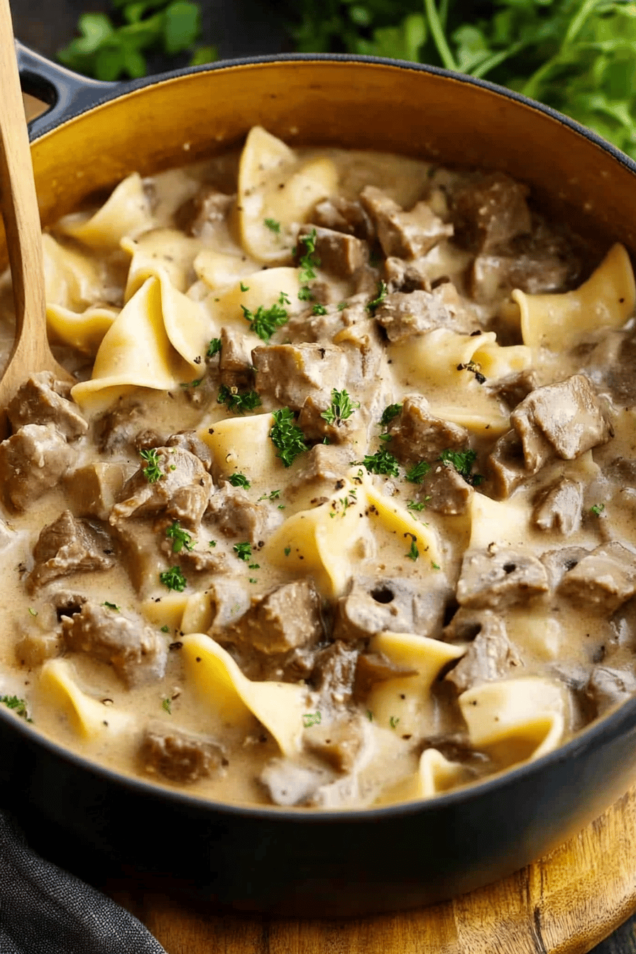 Slow Cooker Beef Stroganoff slice on plate showing perfect texture and swirl pattern