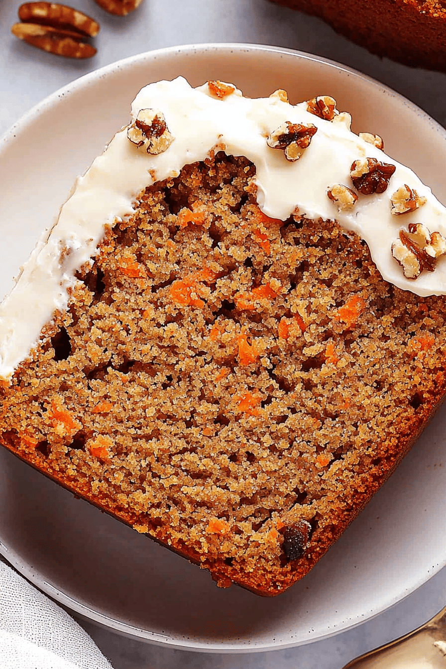 carrot cake loaf slice on plate showing perfect texture and swirl pattern