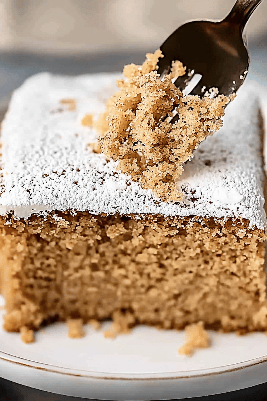 gluten-free spice cake slice on plate showing perfect texture and swirl pattern