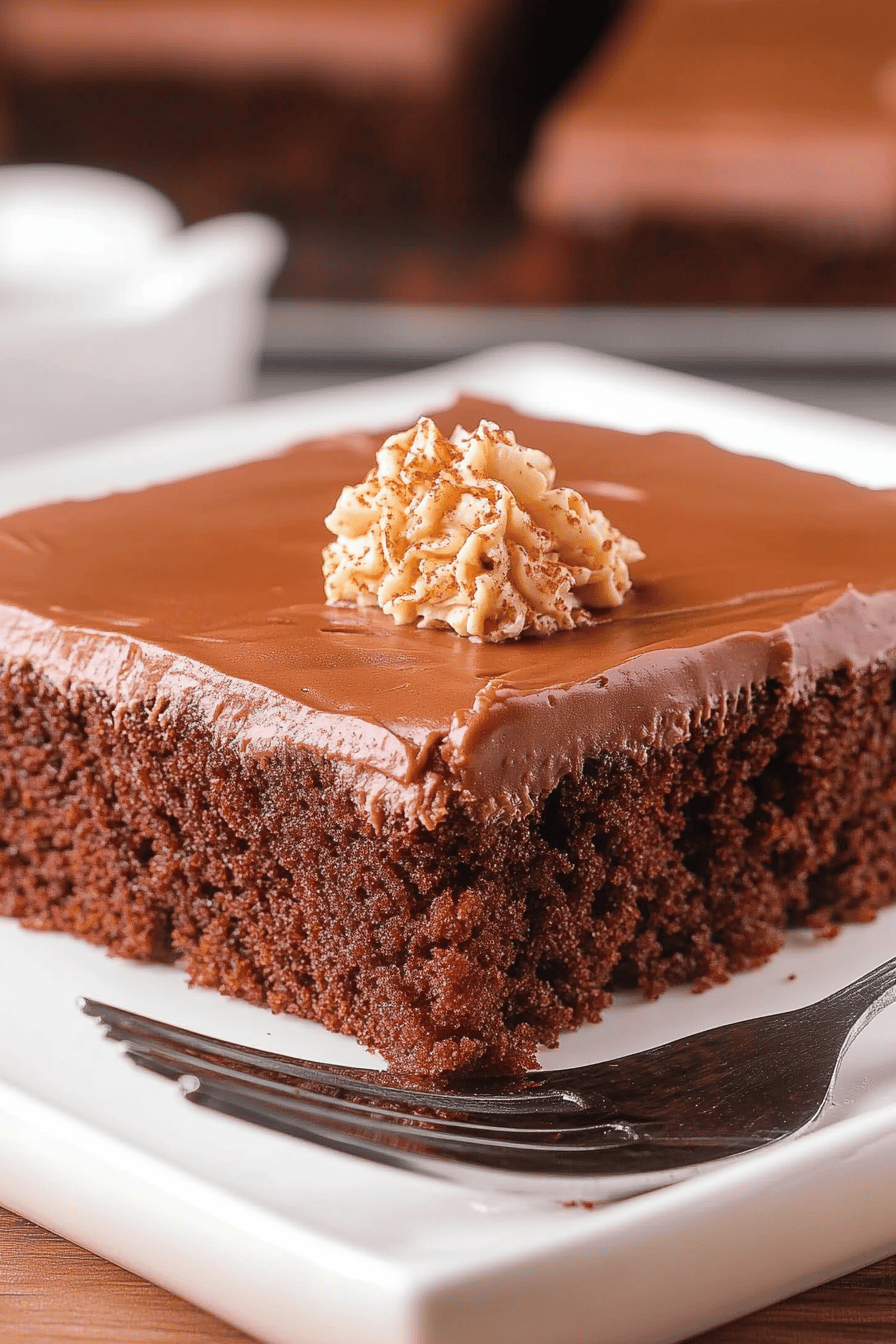 Texas Sheet Cake slice on plate showing perfect texture and swirl pattern