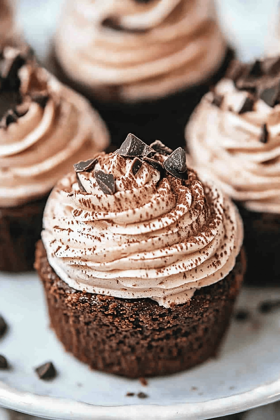 mini chocolate cheesecakes slice on plate showing perfect texture and swirl pattern