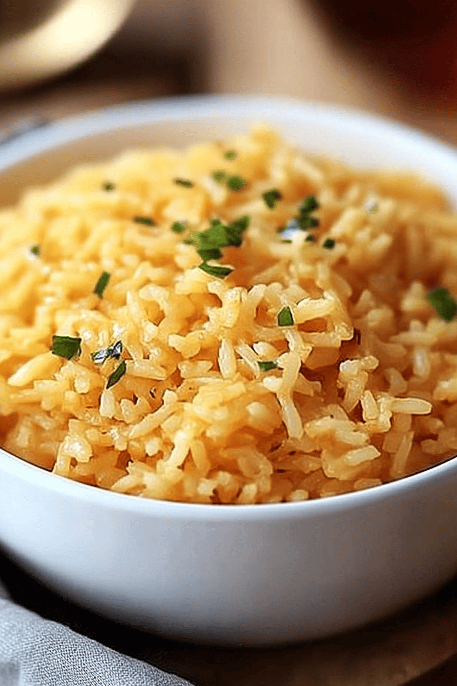 cheesy rice ingredients organized and measured on kitchen counter