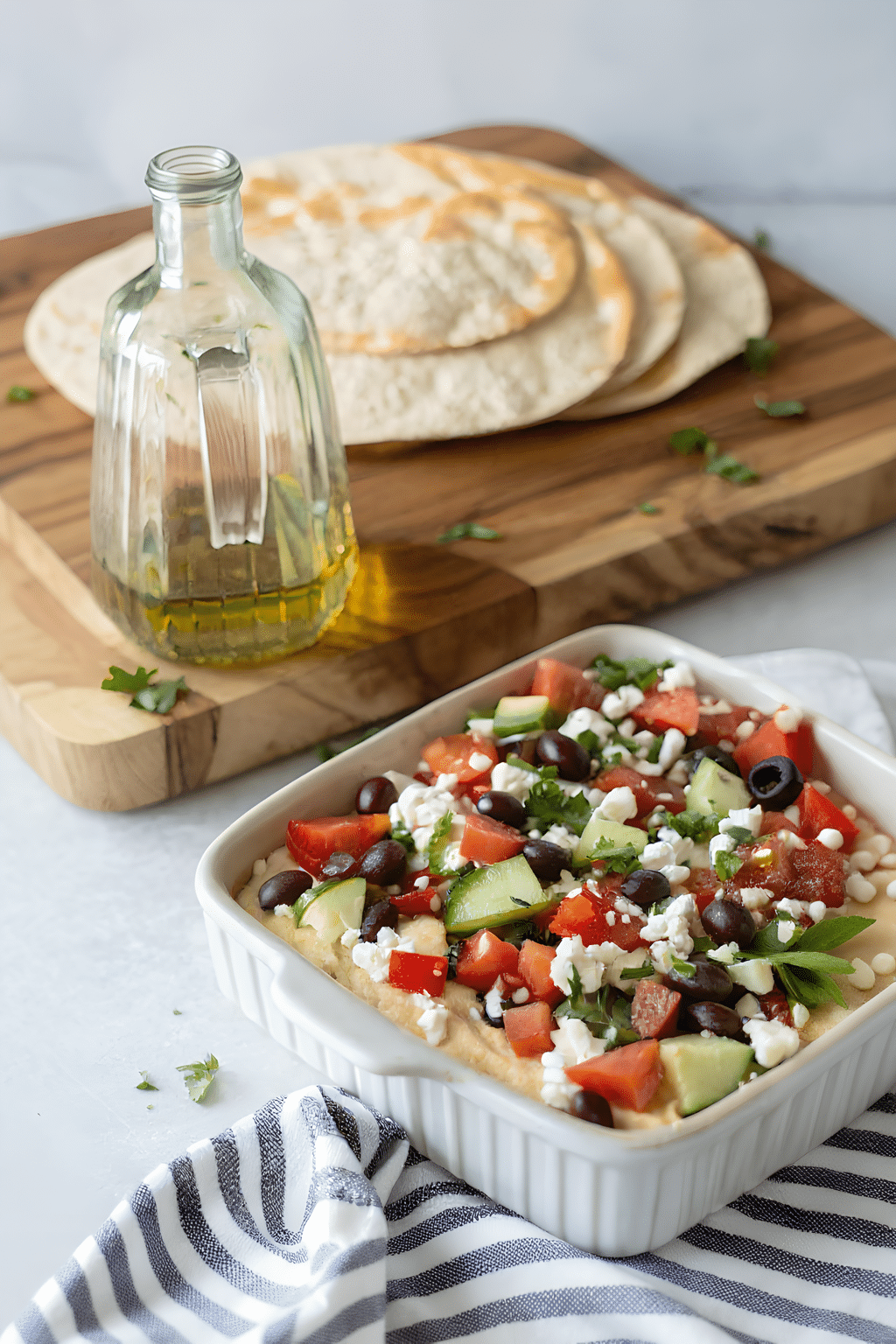 Scoop of Greek layer dip with feta