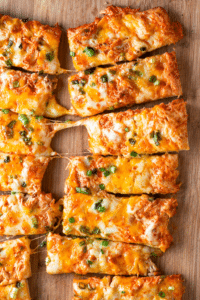 Buffalo chicken pizza sticks with melty cheese