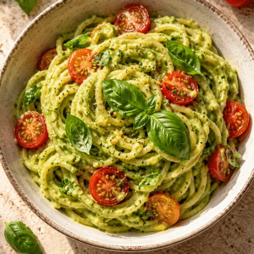 Vegan avocado pesto pasta with cherry tomatoes